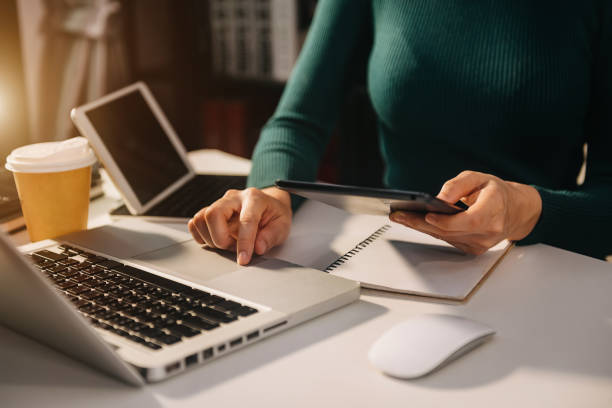 istock business documents on office table with smart phone and digital tablet and graph financial and man working 1433067791