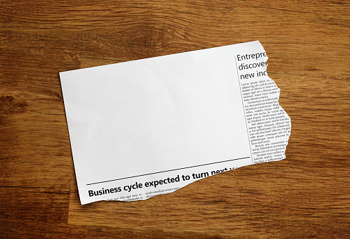 Piece of paper torn from a simulated newspaper, designed by the photographer and free of design copyright. Large blank area in which to insert your copy.