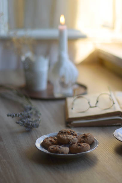 istock Tea, Cookies, Book, Candles and Lavender 1433069098