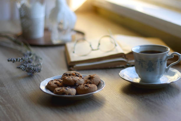 istock Tea, Cookies, Book, Candles and Lavender 1433069099