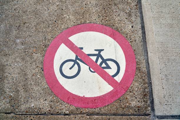 istock Top view of round no bicycle allowed sign on concrete ground 1433069423