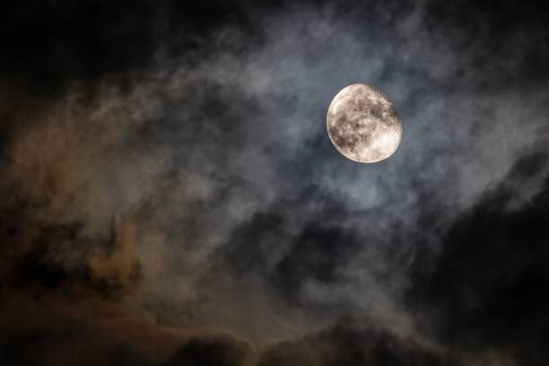 istock Beautiful bright full moon in a cloudy night sky 1433070811
