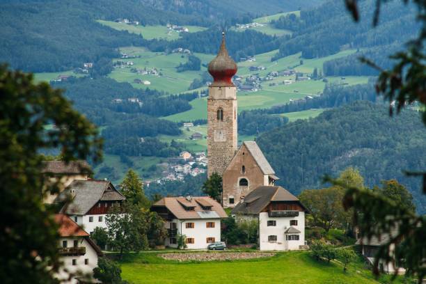 istock Scenic panoramic view of idyllic Dolomites mountain scenery with traditional St. Nicholas church 1433071029