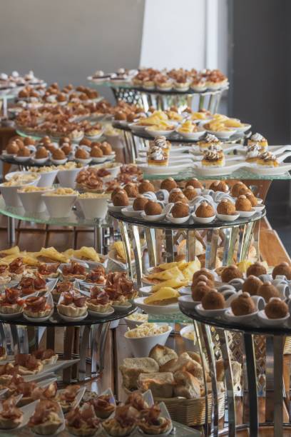 istock Buffet table with the plates of desserts and snacks, a vertical shot 1433071600