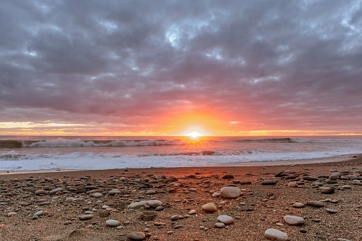 A beautiful sunset over the beach at Greymouth West Coast South Island, New Zealand.