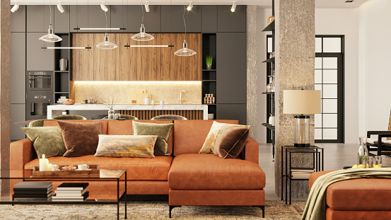 Modern apartment living room interior. Leather sofa, pillows, coffee table, cushion, pendant lamp, pillar, shelves, white walls and kitchen in the background. Copy space template. Render.
