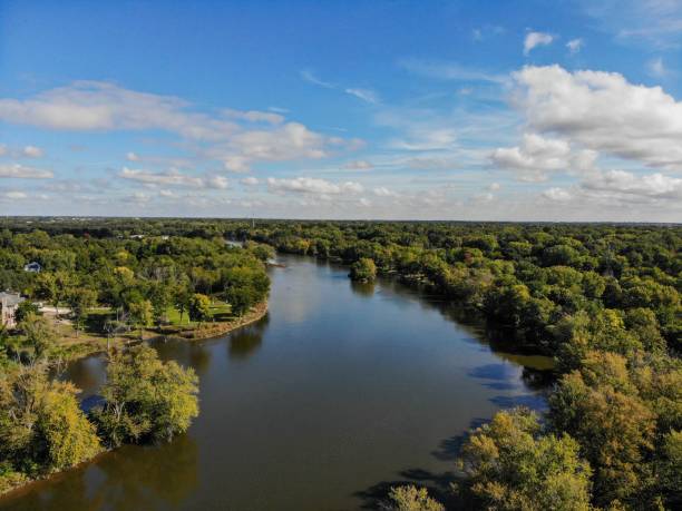 istock High angle shot of a river flowing between green trees on a sunny day 1433072854