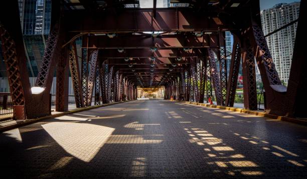 istock Long stone floor under the Train railway bridge in Chicago city with sunlight 1433073763