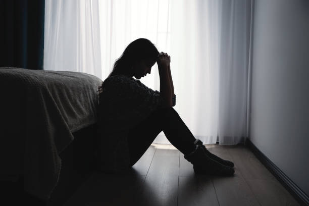 istock Depressed woman. Sadness and headache concept 1433074200