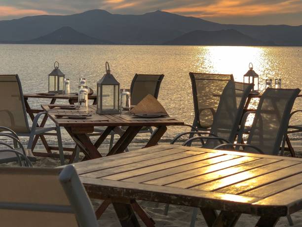 istock Open-air cafe by a lake coast in the sunset 1433074407