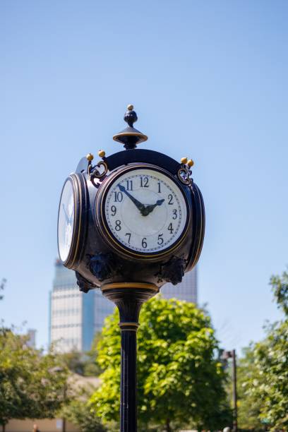 istock Old street clock with a blue sky background 1433075527