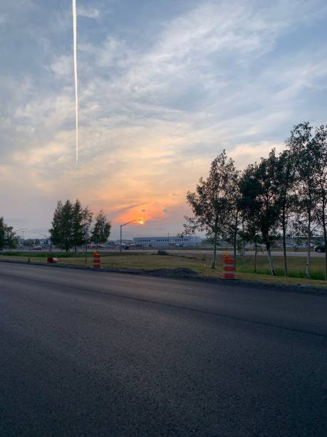 istock empty asphalt road view with the sunset in the background, vertical 1433075571