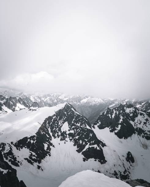 The peaks of snowy mountains covered with clouds, Lucerne, Switzerland