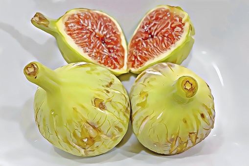 A close up of ripe figs on white background