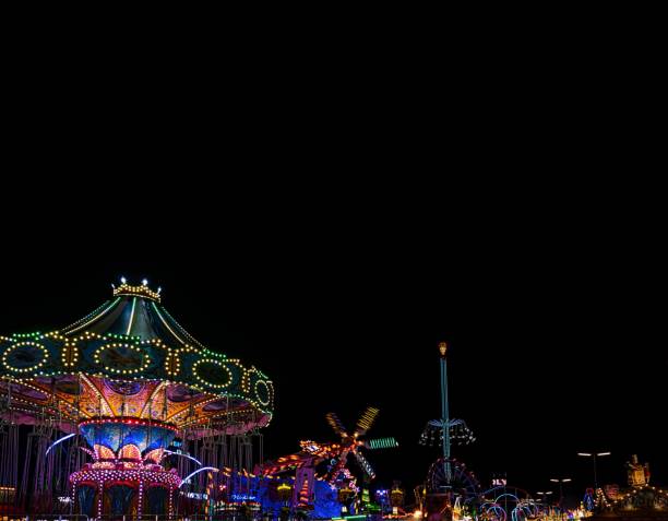 Munich, Germany: a close up shot from Munich Oktoberfest with some carousels by night, Munich, Germany