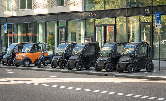 Amsterdam, The Netherlands, 06.10.2022, Tiny microcars parked on a pavement in southern part of Amsterdam