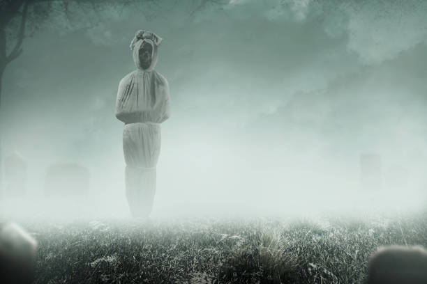 istock Pocong is covered with a white linen shroud standing 1433076764