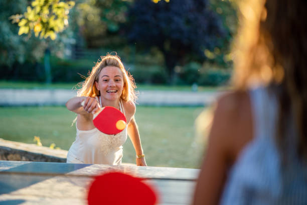 istock Mother playing table tennis whit her daughter on summer day 1433077267