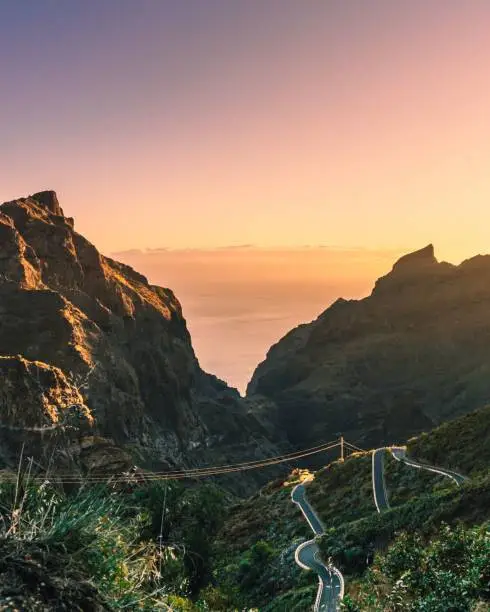 A vertical shot of scenic mountains with a sunset sky in Masca Canyon, Tenerife, Canary Islands