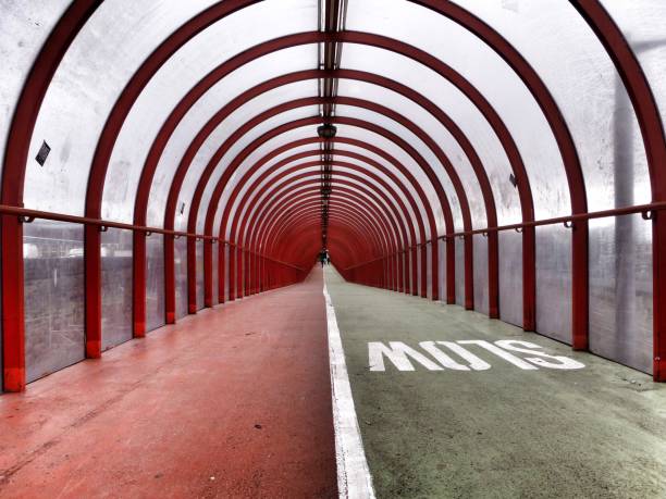 istock Long bridge with a round glass cover and red metallic construction 1433077517