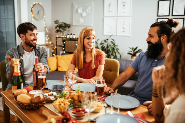 istock Friends and family eating dinner and drinking wine 1433077922