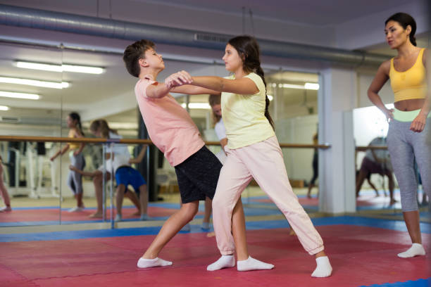istock Teenager children practicing new self defense moves 1433078100
