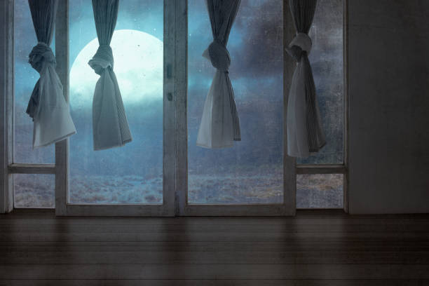 Windows with the curtain in an abandoned house