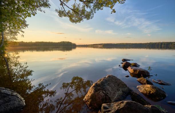 istock Beautiful sunset sky over a blue rocky pond in a park 1433078262