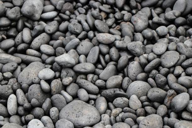istock Closeup shot of grey pebbles 1433078356