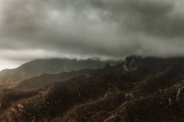 istock Scenic view of mountains with heavy clouds in the sky 1433079849