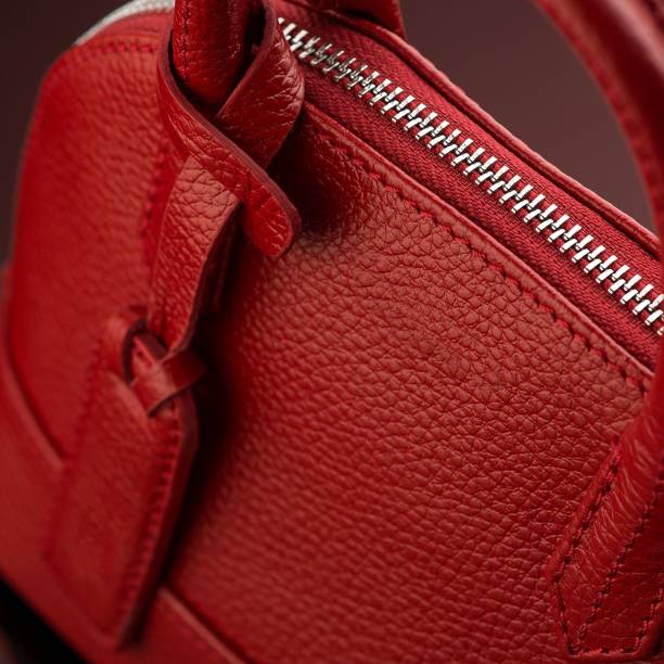 istock Closeup shot of a luxury red leather bag 1433083380