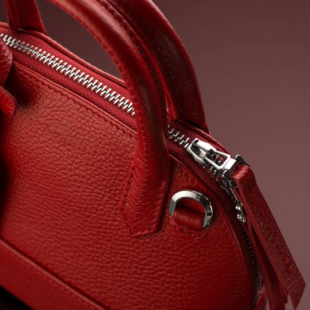 istock Closeup shot of a luxury red leather bag 1433083381
