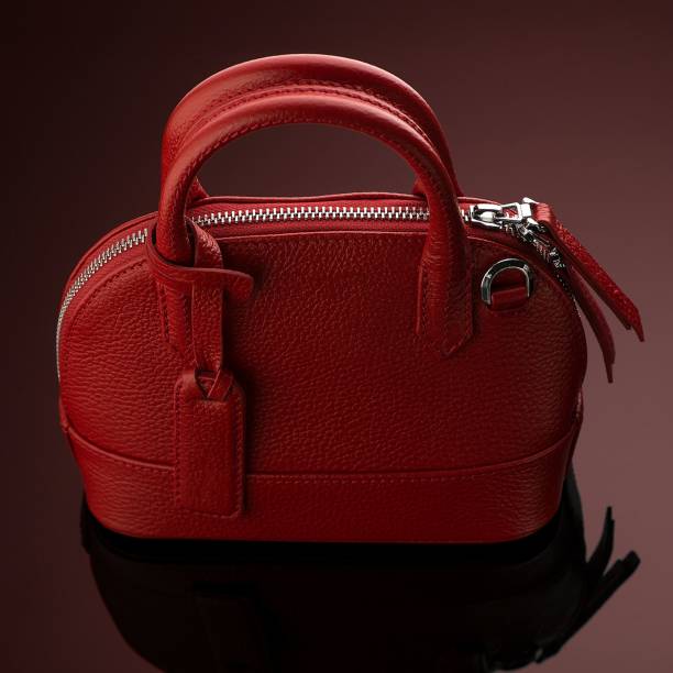 istock Closeup shot of a luxury red leather bag 1433083383