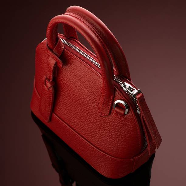 istock Closeup shot of a luxury red leather bag 1433083384