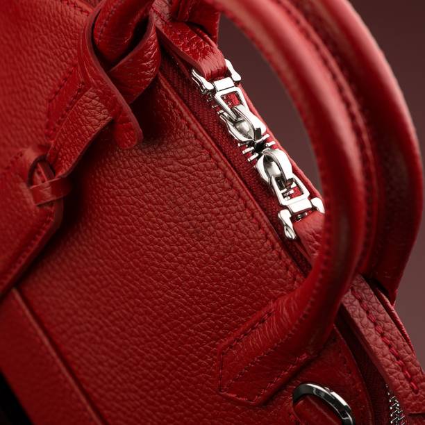 istock Closeup shot of a luxury red leather bag 1433083385