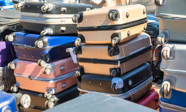 a pile of suitcases at the police station stolen from the train station