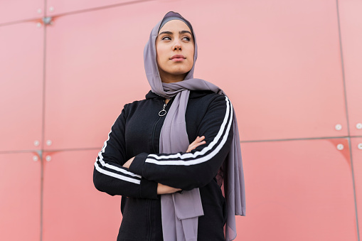 muslim woman arms crossed sport, Confident Islamic woman in sportswear