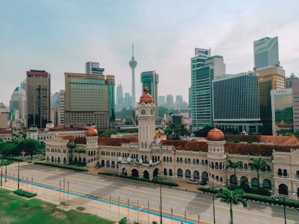 Aerial view of Kuala Lumpur Urban Skyline Aerial view of Merdeka Square and Sultan Abdul Samad Building in Kuala Lumpur, Malaysia, with the urban cityscape as ackground merdeka square stock pictures, royalty-free photos & images