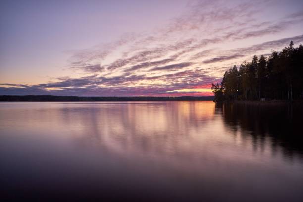 istock Beautiful view of a clear lake and forest during sunset 1433084717