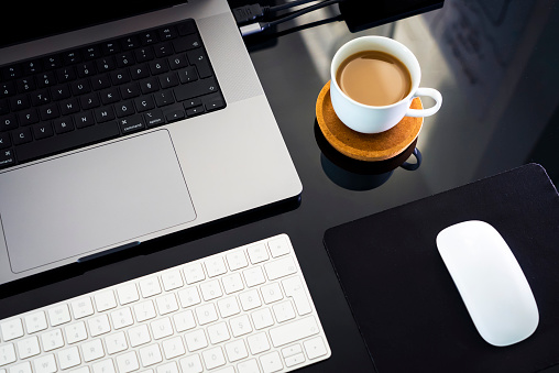 Clean and tidy desk of an employee in a modern office.