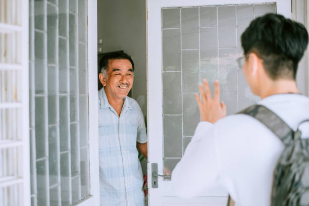 istock Home caregiver – young man helping senior man 1433085352