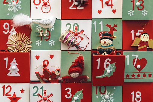 close up of old wooden advent calendar with vintage decoration