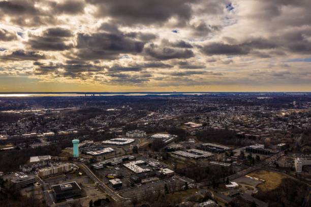 istock Drone shot of a cityscape view under cloudy sky at sunset 1433088606