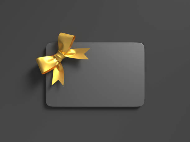 schwarze geschenkkarte mit goldener schleife - giftcard stock-fotos und bilder
