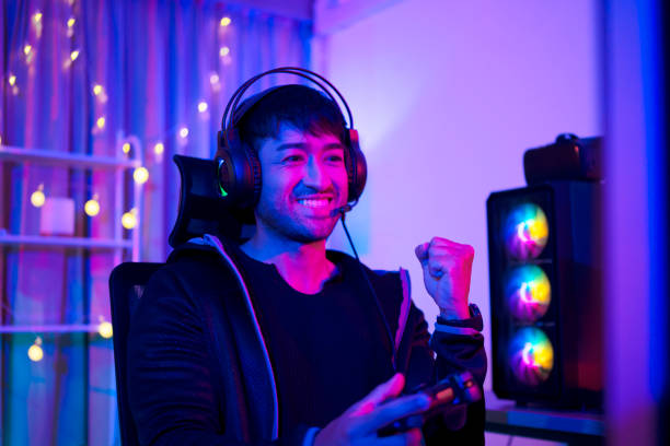 istock Play video game online at home. 1433092037
