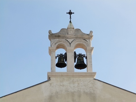Vew of Igreja da Graca white church bell tower, Convento de Nossa Senhora da Graca, a nuns convent in Lisbon, Portugal.