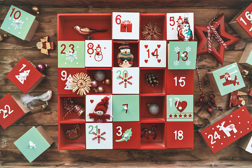 old wooden advent calendar with vintage decoration