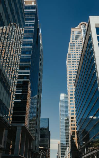 istock Low angle shot of modern skyscrapers against a blue sky in Calgary, Alberta, Canada 1433094343