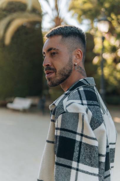 istock Vertical of handsome pierced and tattooed caucasian man's profile. 1433094825