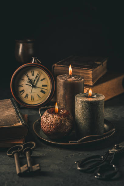 istock Candles,  antique books, old clock and old rusty keys in vintage style 1433100430